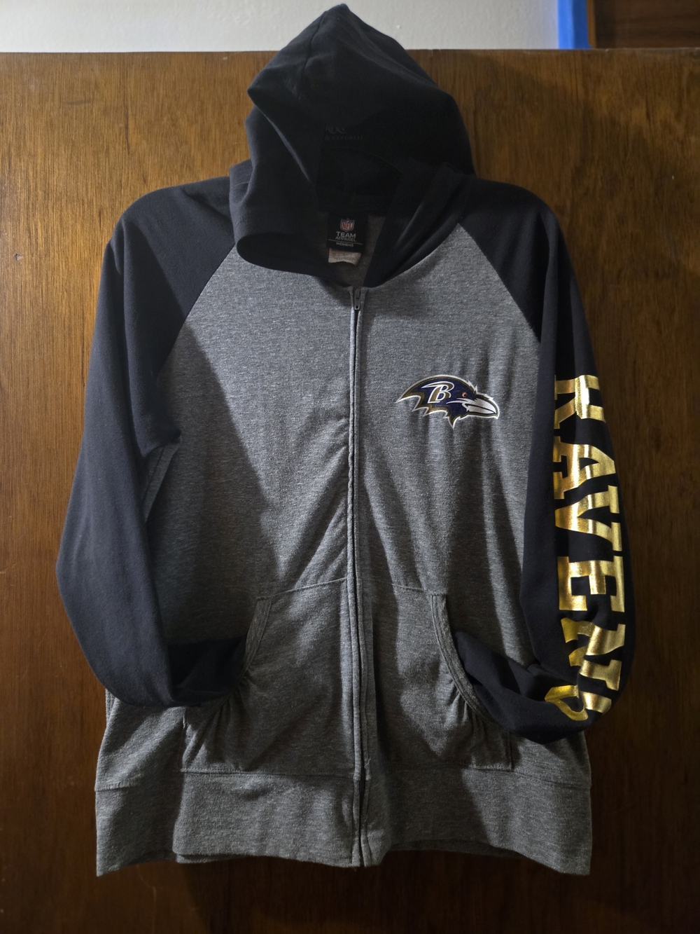 NFL Baltimore Ravens Gray and Black Zip Hoodie with Gold Sleeve Text